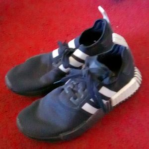 Black and white Adidas tennis shoes